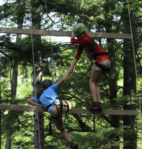 Two campers on the high ropes challenge Jakobs ladder