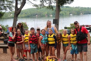 Image of happy campers at the waterfront