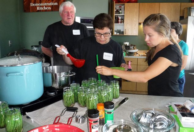 Master Food Preserver class participants making dilly beans