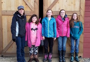 4-H kids in front of barn