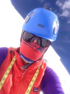 Kit Hamley wearing sun glasses, helmet, and scarf