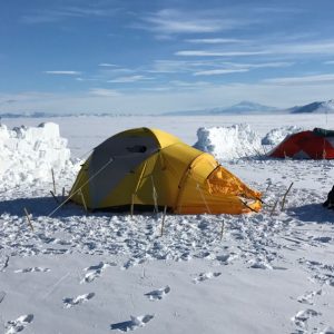 tent and snow windbreak on Antarctic ice sheet