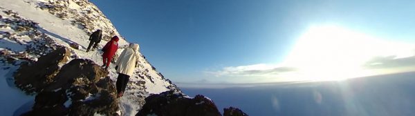 Researchers climbing Observation Hill next to McMurdo Station
