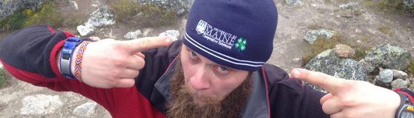 Charles Rodda wearing a UMaine Cooperative Extension hat at Salkantay Pass.