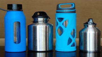 several reusable water bottles on a table