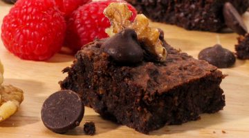 Black bean brownie with walnuts, chocolate chips, and raspberries on the side