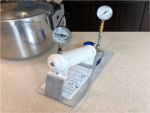 a dial gauge tester unit sitting on a kitchen counter