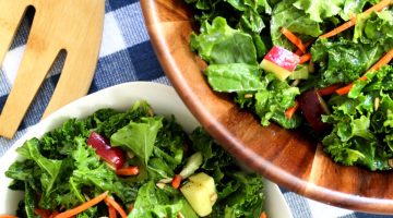 massaged kale salad in a wooden salad bowl
