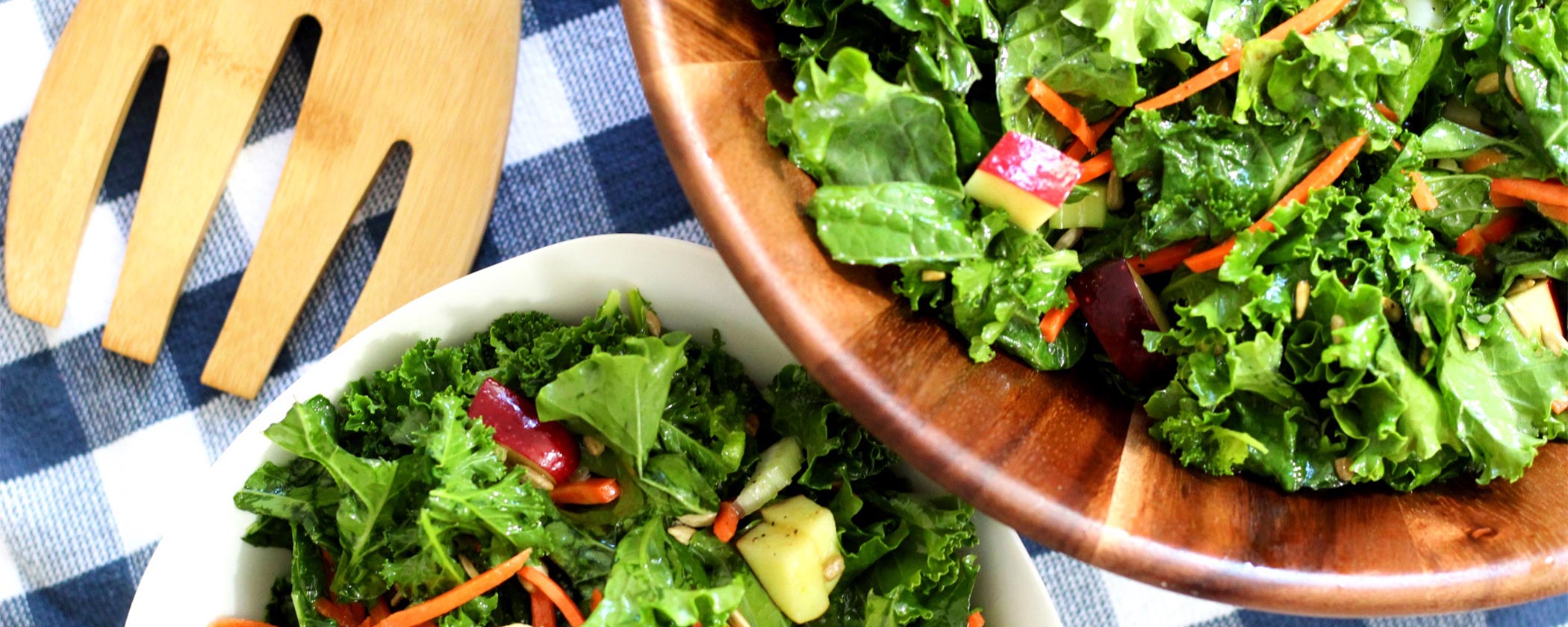 massaged kale salad in a wooden salad bowl