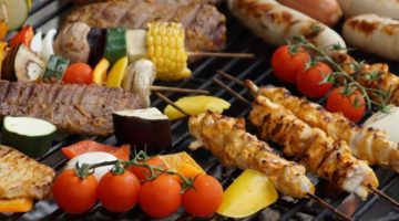 meat and vegetables on a grill