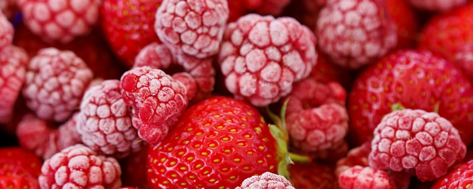 close up of frozen raspberries and strawberries