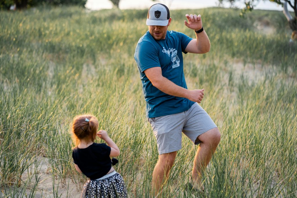 Father and child dancing.