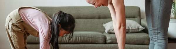 Woman stretching with her daughter