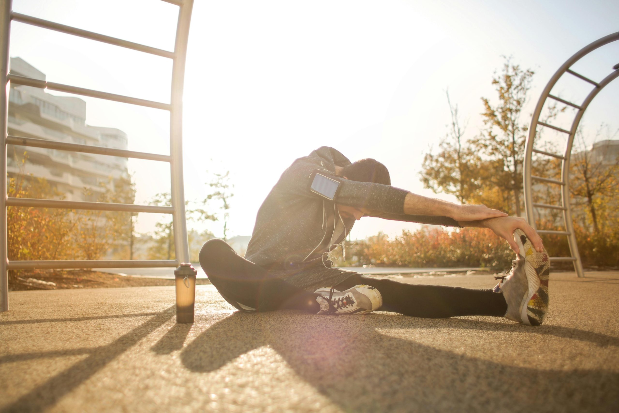 A person stretching at the park.