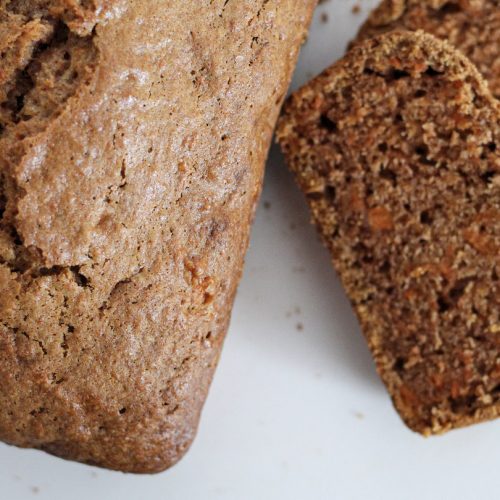 carrot bread loaf with slices of carrot bread