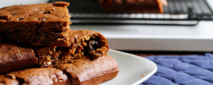 Molasses bars stacked in a pile on a white plate