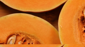 Close-up of four pieces of butternut squash cut.