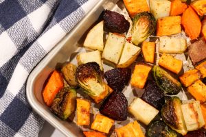 Roasted fall vegetables on a baking sheet.