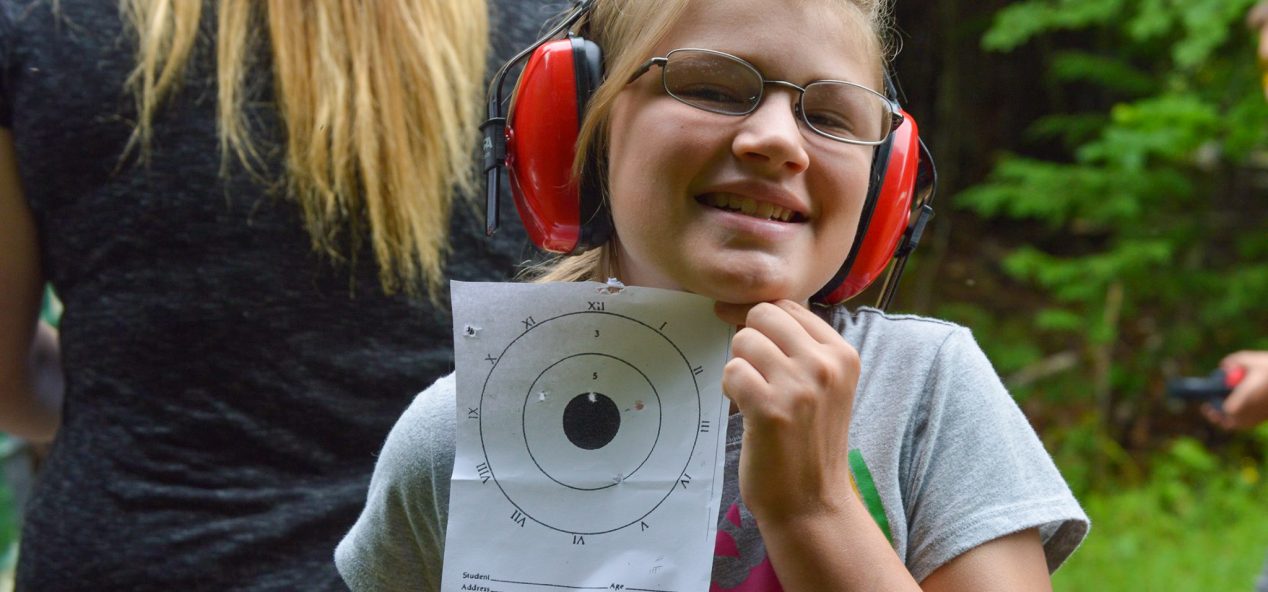 Camper holding Target from the range
