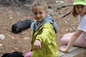 Camper showing caterpillar on their arm