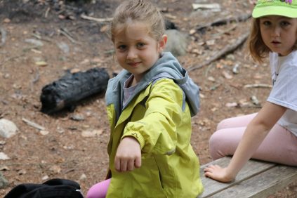 Camper showing caterpillar on their arm