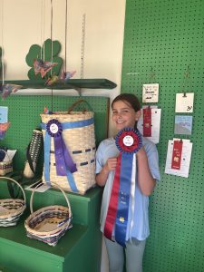Youth celebrating their basket winning Best in Show.