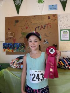 Cece celebrating her club's project award.