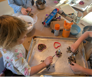 Youth making bird feeders.