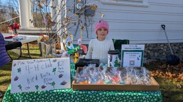 Youth selling treats at a market.