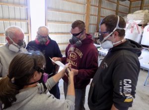 Participants wearing respirators at a respirator fit test.