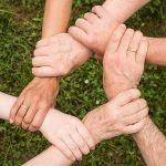 six hands linking to show team spirit