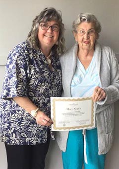 Lisa Fishman present Mary Soper with a 60-Year Certificate