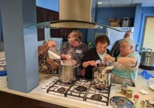 a group of Cumberland County Extension Homemakers making jam