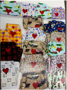 a variety of pajamas with hearts sewn on them