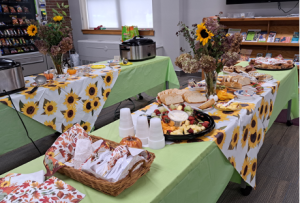 a couple of decorated tables with lunch items on display