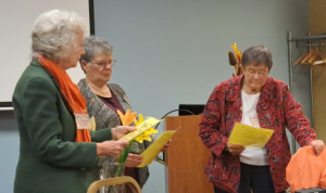 three women who are members of the Extension Homemakers group at a meeting