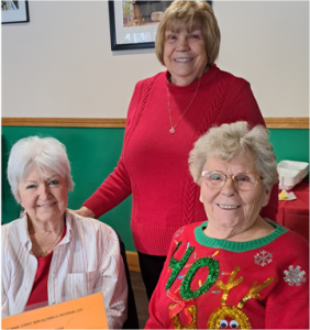 Three Extension Homemaker members from Cumberland County attending a holiday luncheon