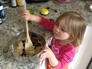 child preparing food in the kitchen