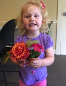toddler with flowers