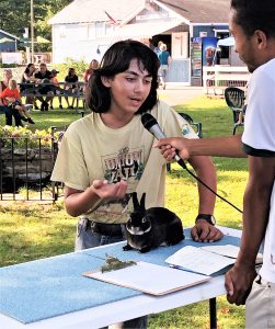 4-H member with rabbit being interviewed by judge at Pet show