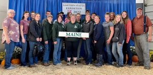 group of 4-H youth and leaders posing with Maine sign