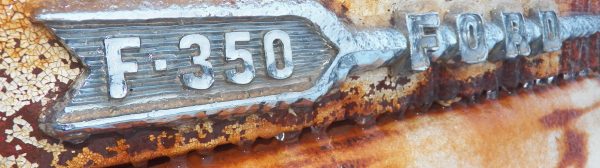 closeup of F-350 Ford emblem with ice