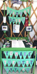 Display about Learn by Doing by Warren After School 4-H Club with Red Ribbon