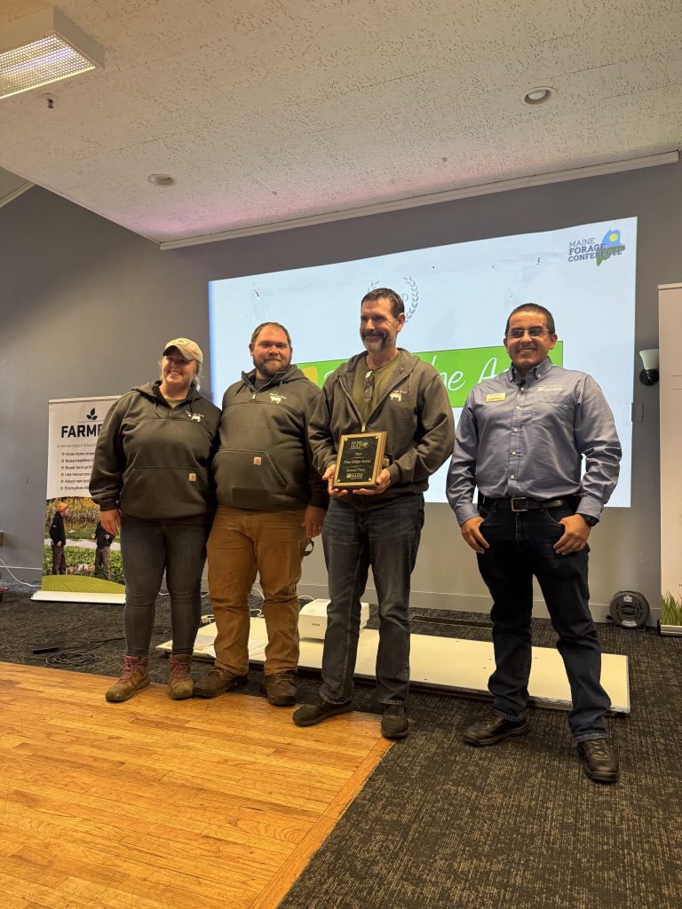 Pine Ridge Acres accepting second place at 2025 Maine Hay Contest