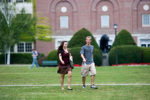 two university students walking on campus