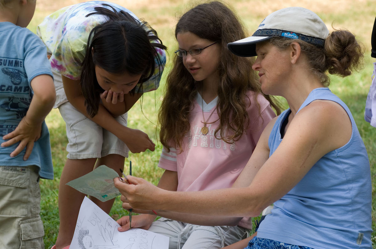 participants observing illustrations at Blueberry Cove 4-H day camp