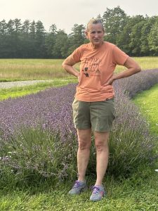 Marcia Lyons standing in from of her field of lavendar at SeaLyon Farm.