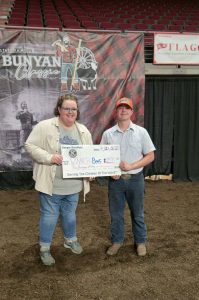 Kiwanis representative presenting check to youth member.