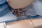 Sewing machine and blue fabric