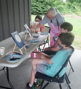 youth and volunteer painting